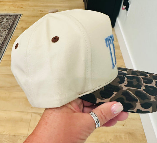 TEXAS Puff Embroidery in Dusty Blue on a natural and leopard hat