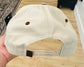 TEXAS Puff Embroidery in Dusty Blue on a natural and leopard hat